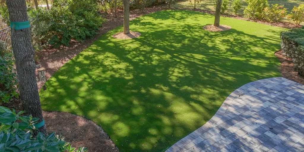 Backyard artificial grass installation from Jax Outdoor Solutions