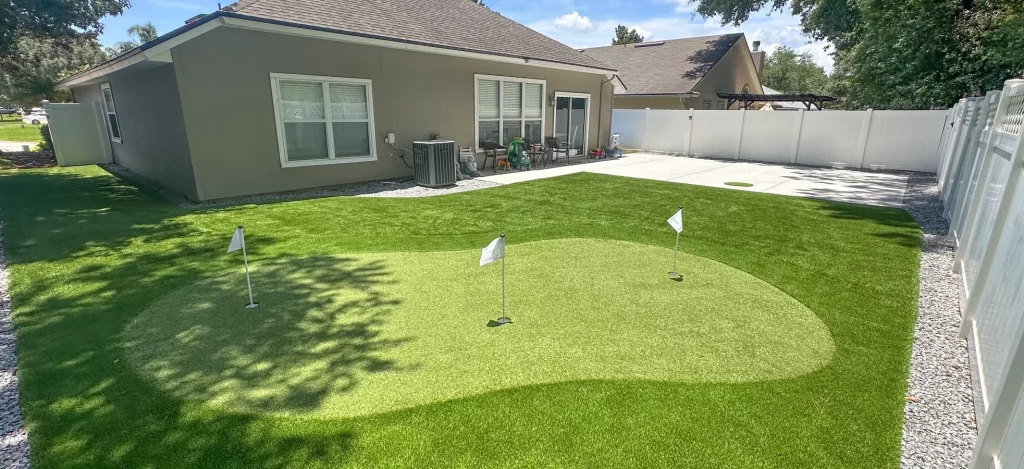 Backyard golf green installed by Jax Outdoor