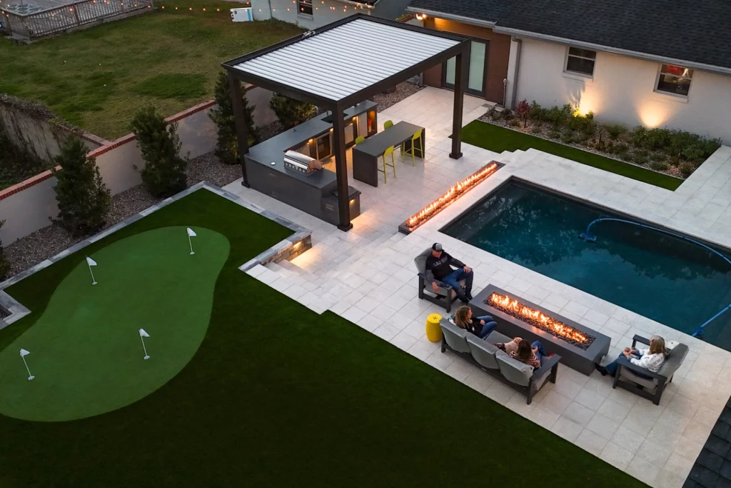 backyard putting green, outdoor kitchen & fireplace
