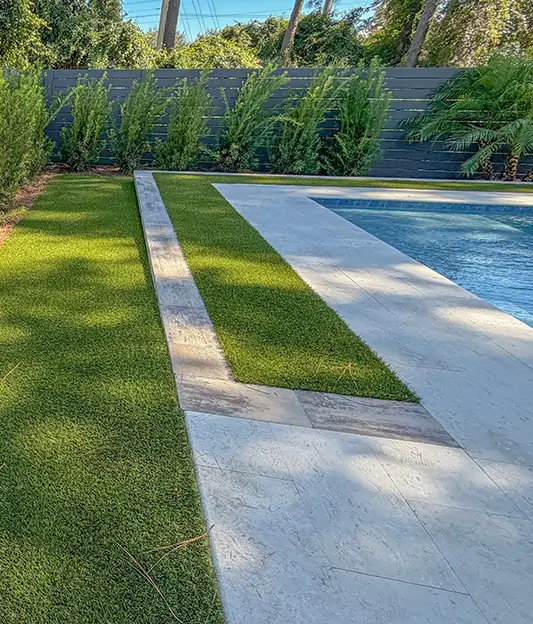 Close-up shot of artificial grass pool surround 